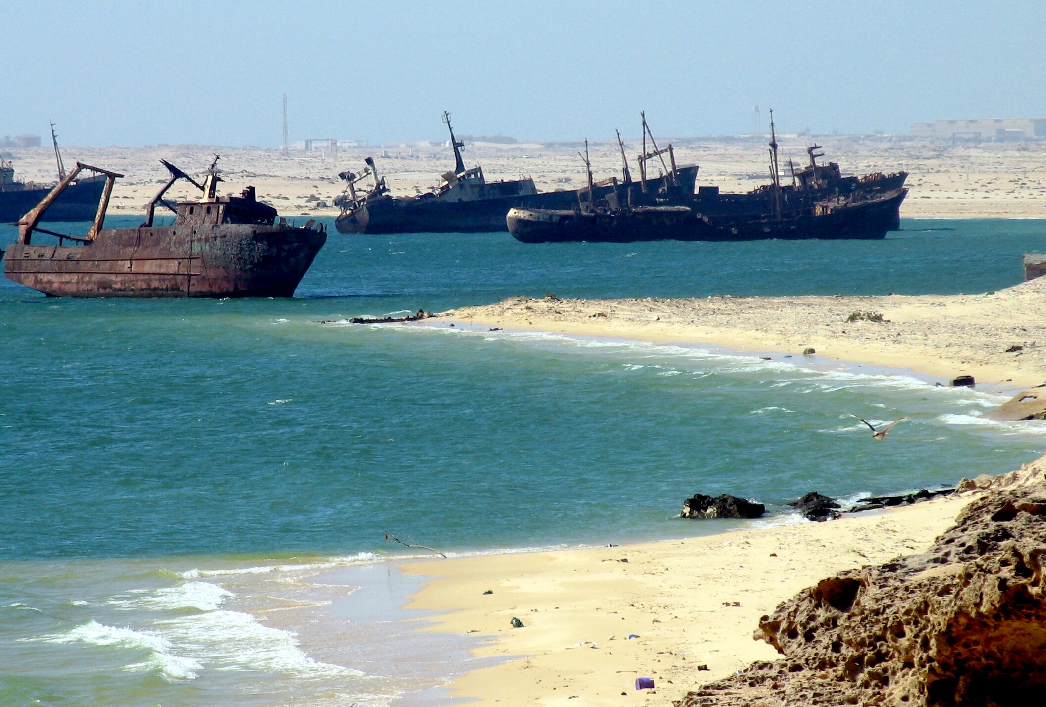 Abandoned, rusting vessels along the coast at Nouadhibou, Mauritania, photographed in 2004.